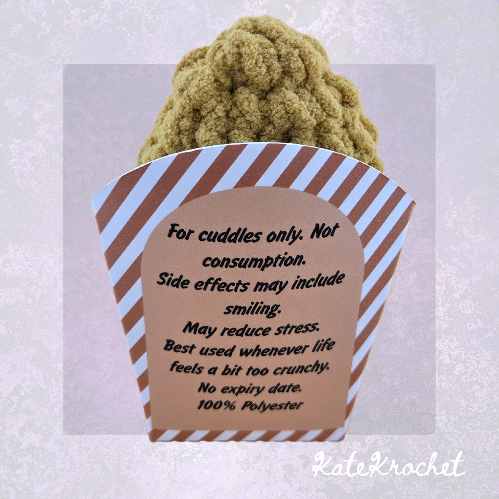 Back of handmade Emotional Support Nugget fry box with humorous cuddle and care message by KateKrochet