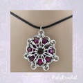 Close up of a Chainmaille Captured Glass Bead Flower Pendant in Crimson by KateKrochet