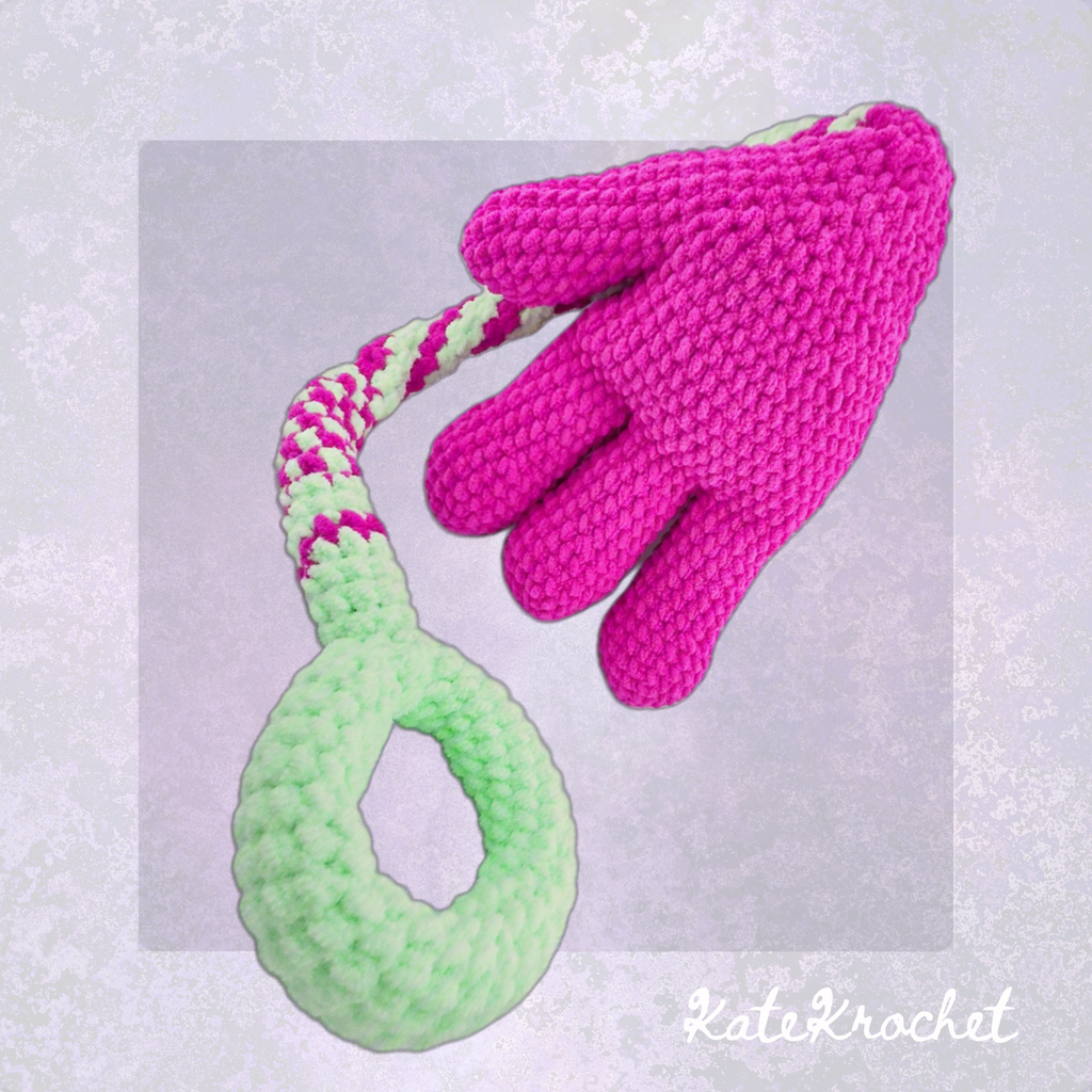 A Handmade Crocheted Giant Slappy Hand in Magenta and Bright Green Colours made by KateKrochet