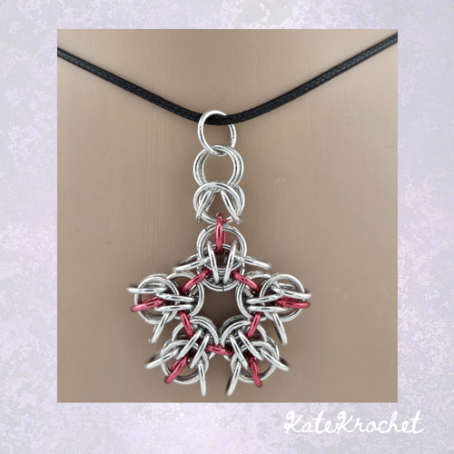 Close-up of handmade Pixie Link 5 pointed star chainmaille pendant made by KateKrochet